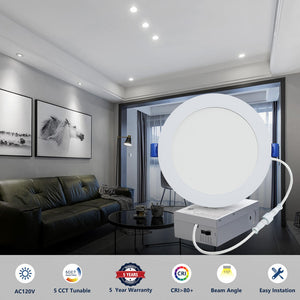 Slim canless LED recessed light with junction box shown against an illuminated living room ceiling