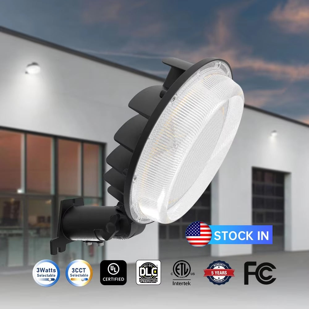 LED barn light with selectable wattage and color temperature, shown against a building exterior at dusk