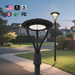 High-output selectable LED post top light installed along a walkway at dusk