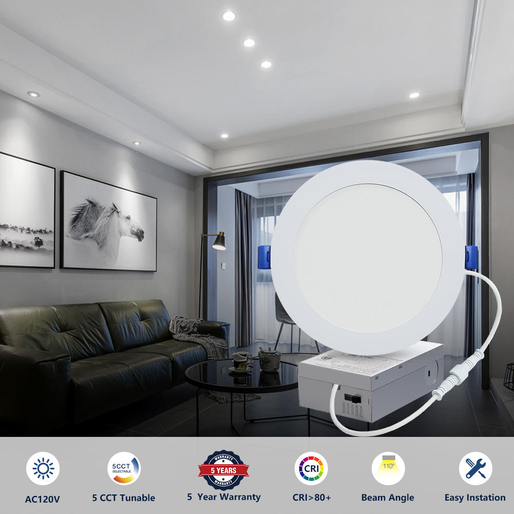 Slim canless LED recessed light with junction box shown against an illuminated living room ceiling